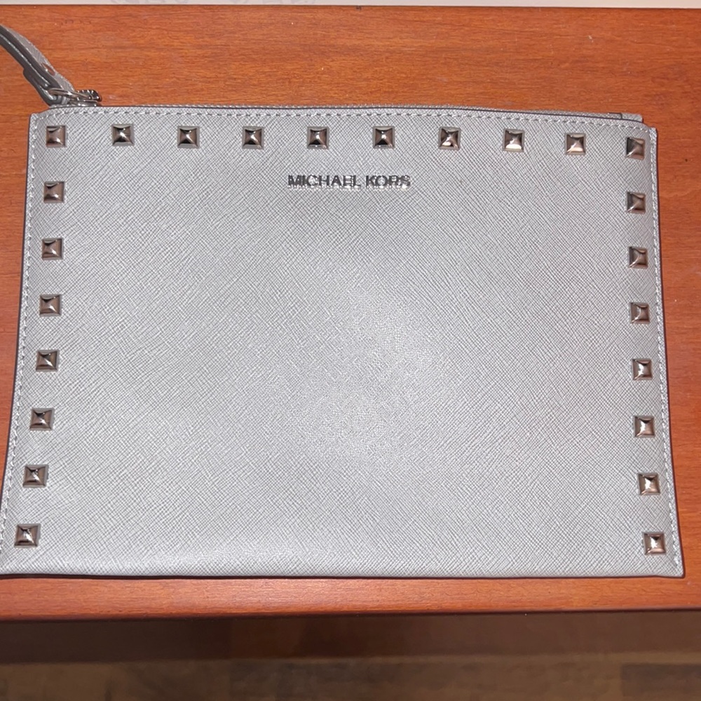 Grey studded Michael Kors wristlet